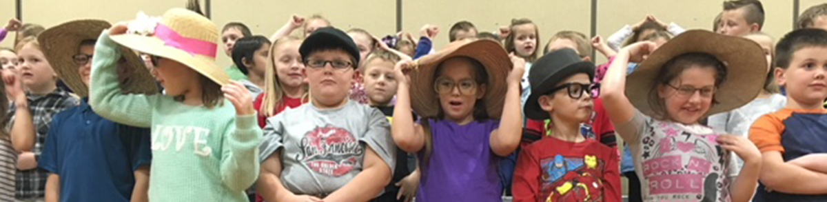 elementary students wearing hats
